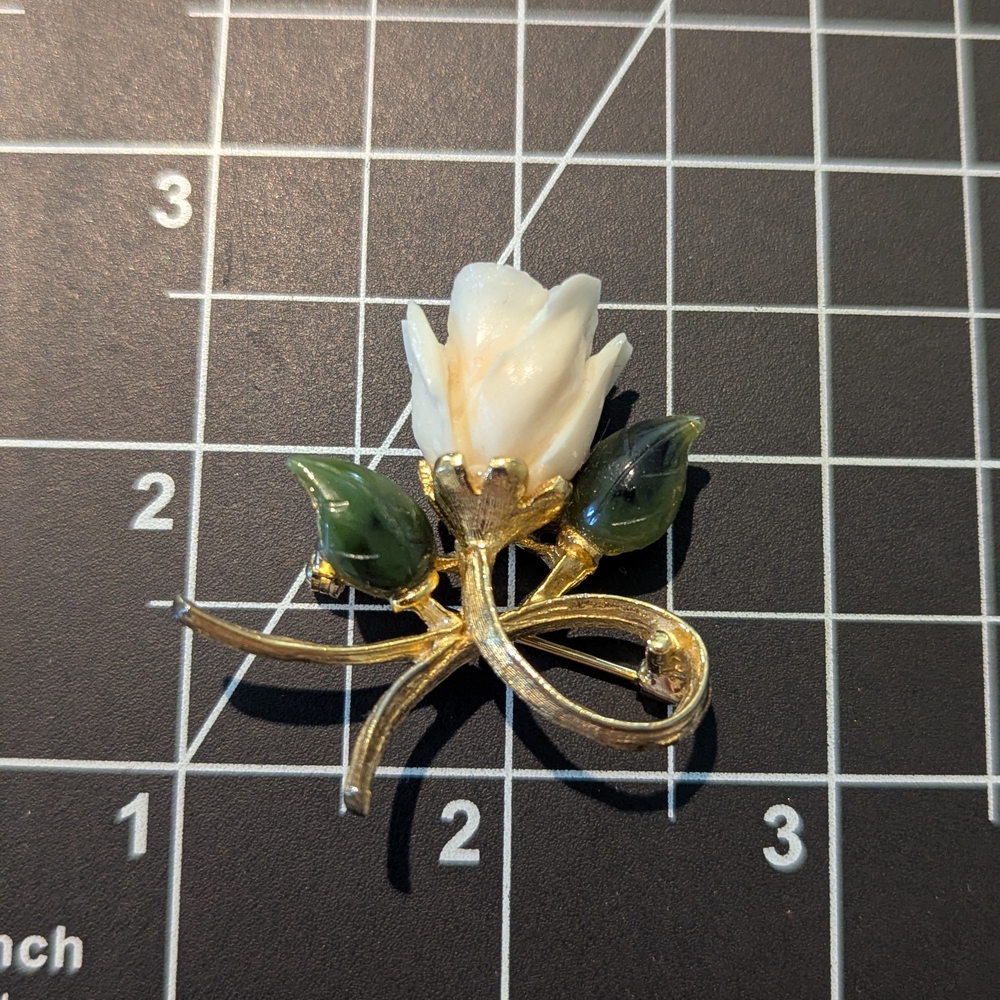 Elegant Gold and White Floral Brooch